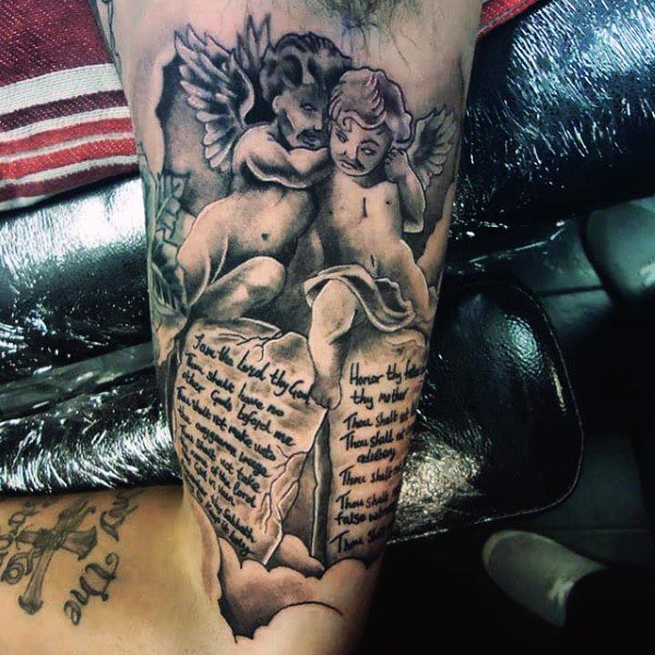 angels and scripture inner bicep tattoo for men