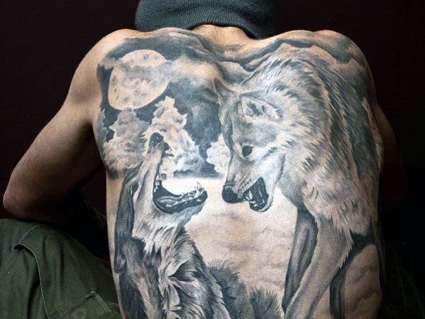 angry wolves back tattoo for men
