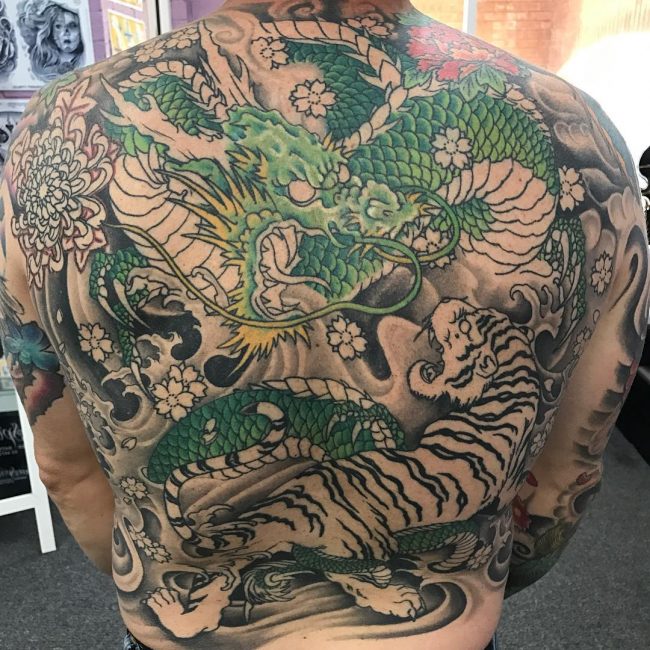 colored dragon and tiger back tattoo for men