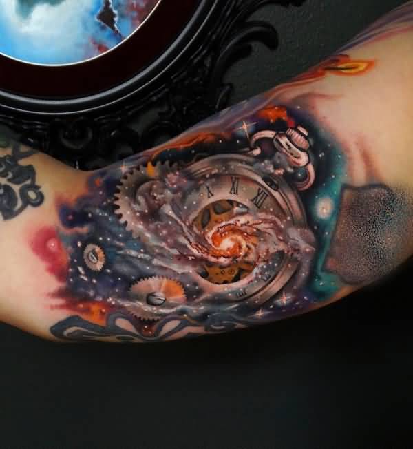 cosmic clock inner bicep tattoo for men