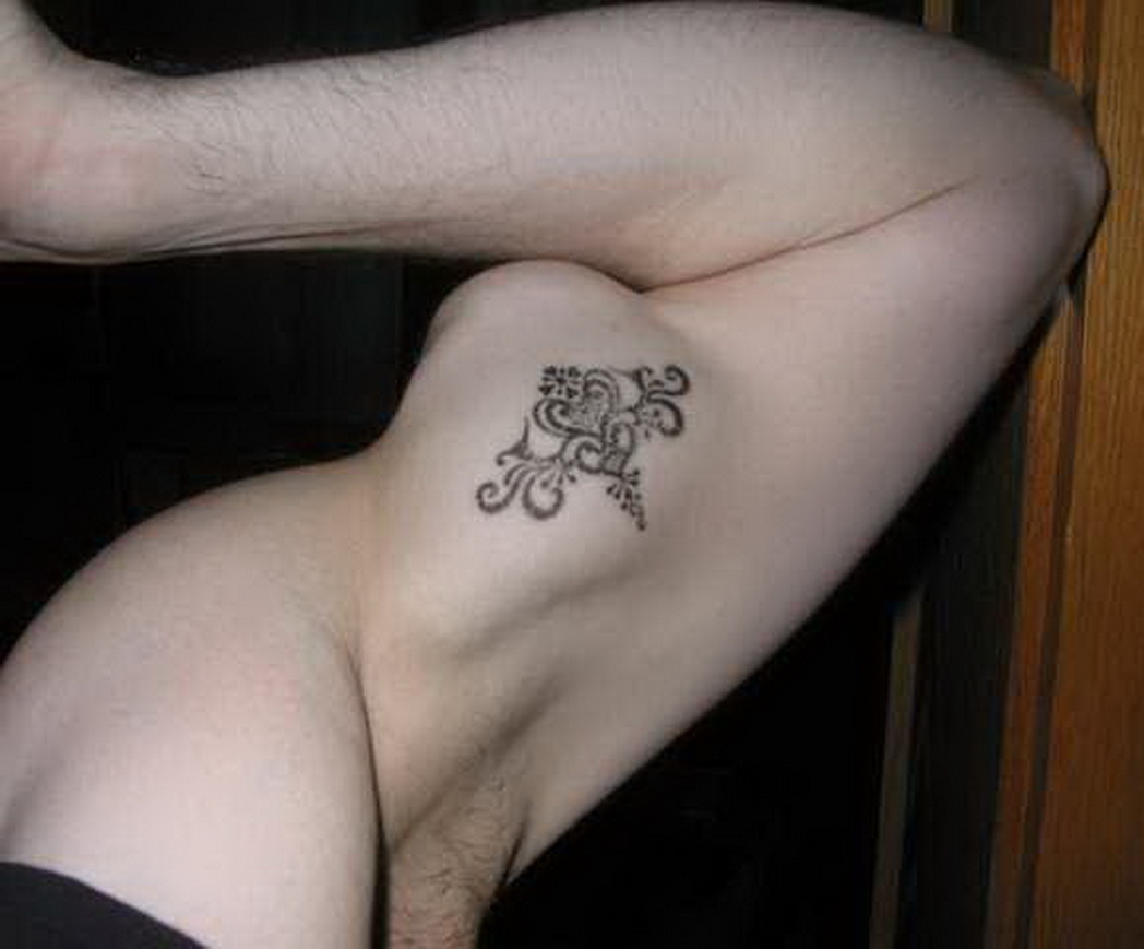 design inner bicep tattoo for men