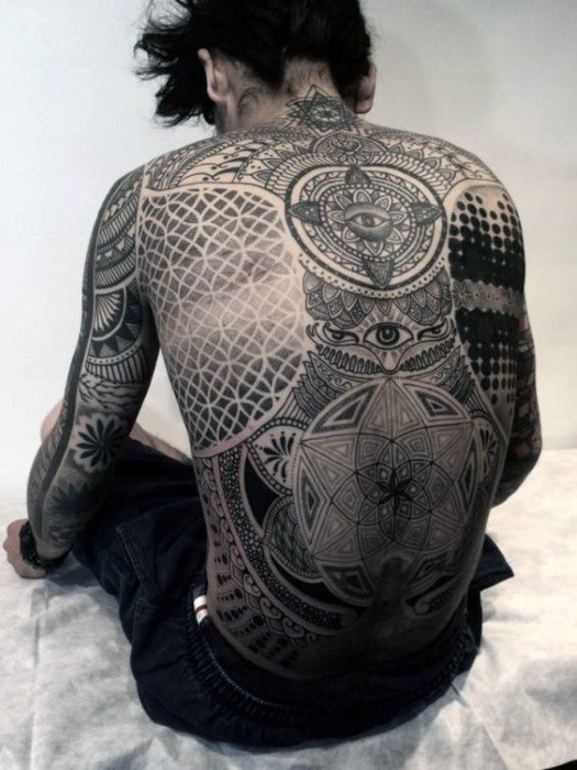 eyes and geometric design back tattoo for men