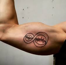 infinity inner bicep tattoo for men