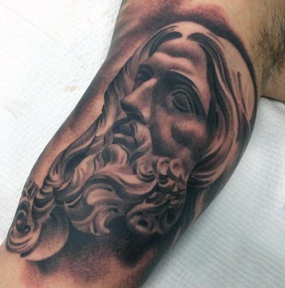 jesus face inner bicep tattoo for men