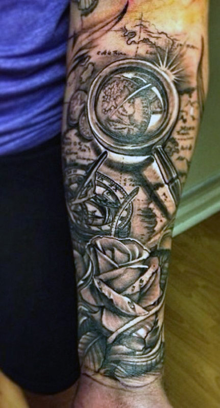 magnifying glass and compass tattoo for men