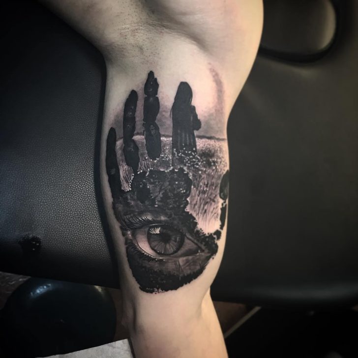 palm and eye inner bicep tattoo for men