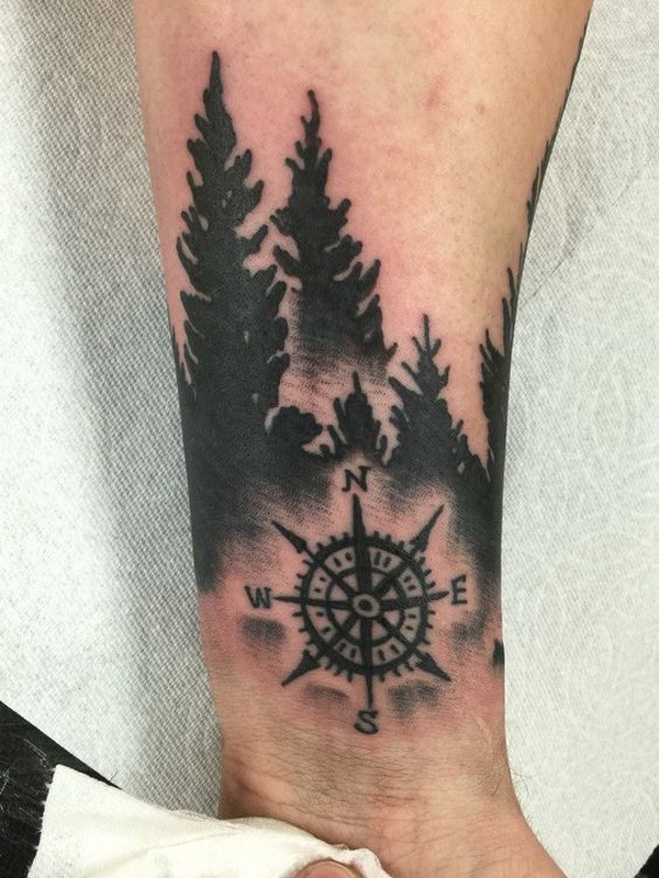 pine trees and compass tattoo for guys