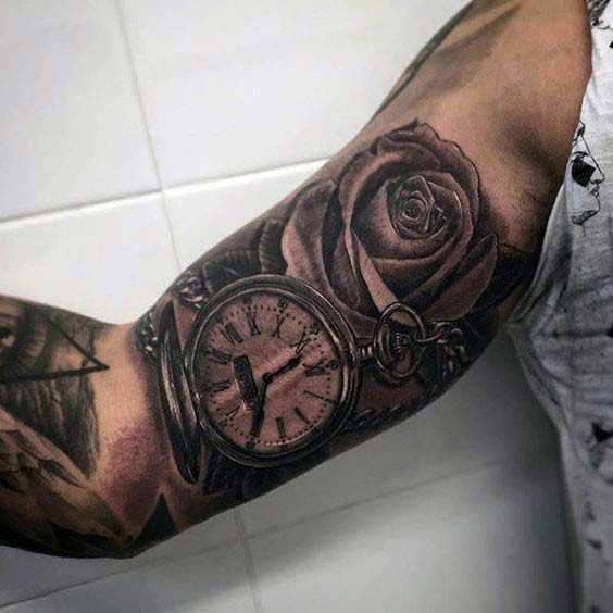 pocket watch and rose inner bicep tattoo for men