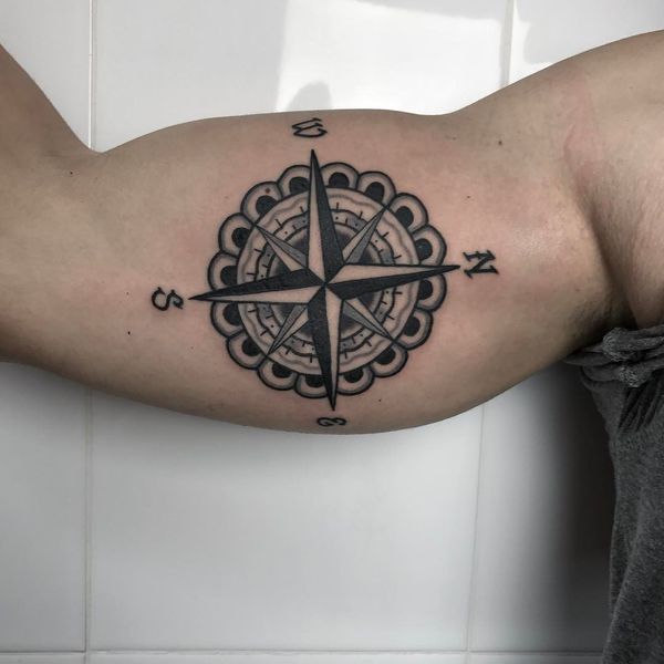 rounded border compass tattoo for guys