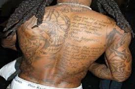 skull and poem back tattoo for men