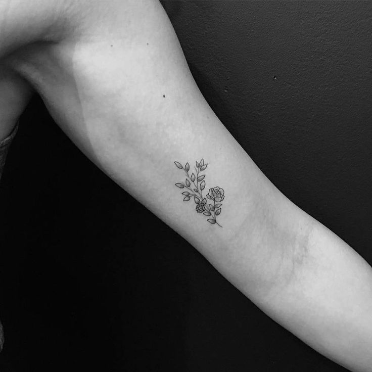 small flower inner bicep tattoo for men