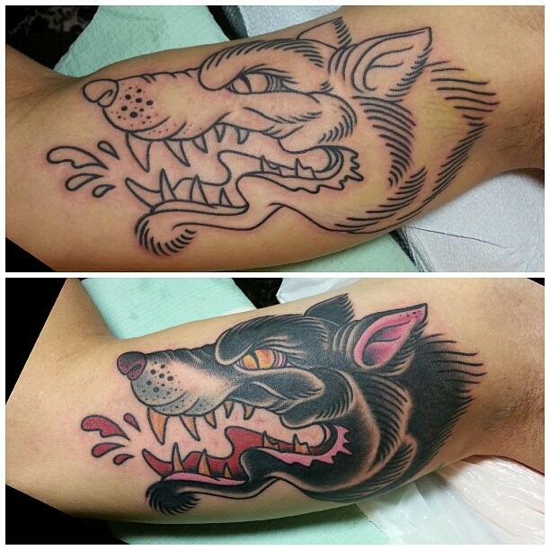snarling wolf inner bicep tattoo for men