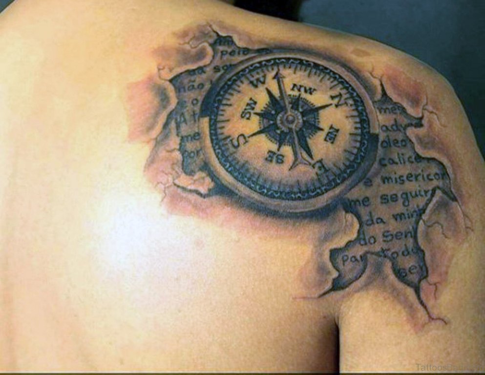 tattered parhment and compass tattoo design for men