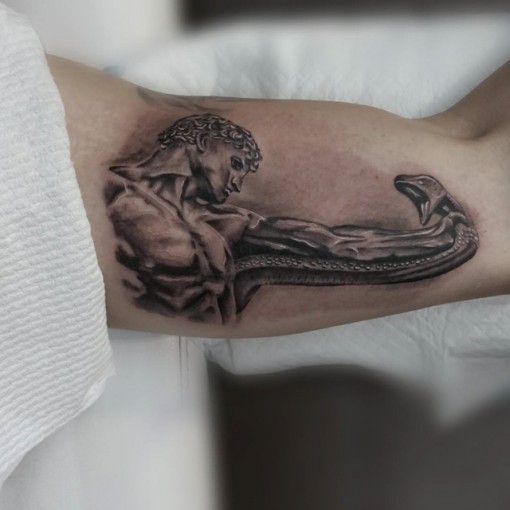 titan inner bicep tattoo for men