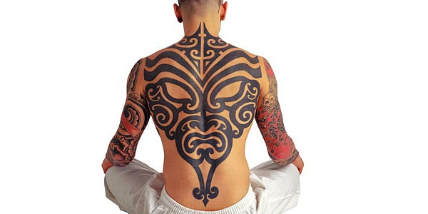 tribal face back tattoo for men