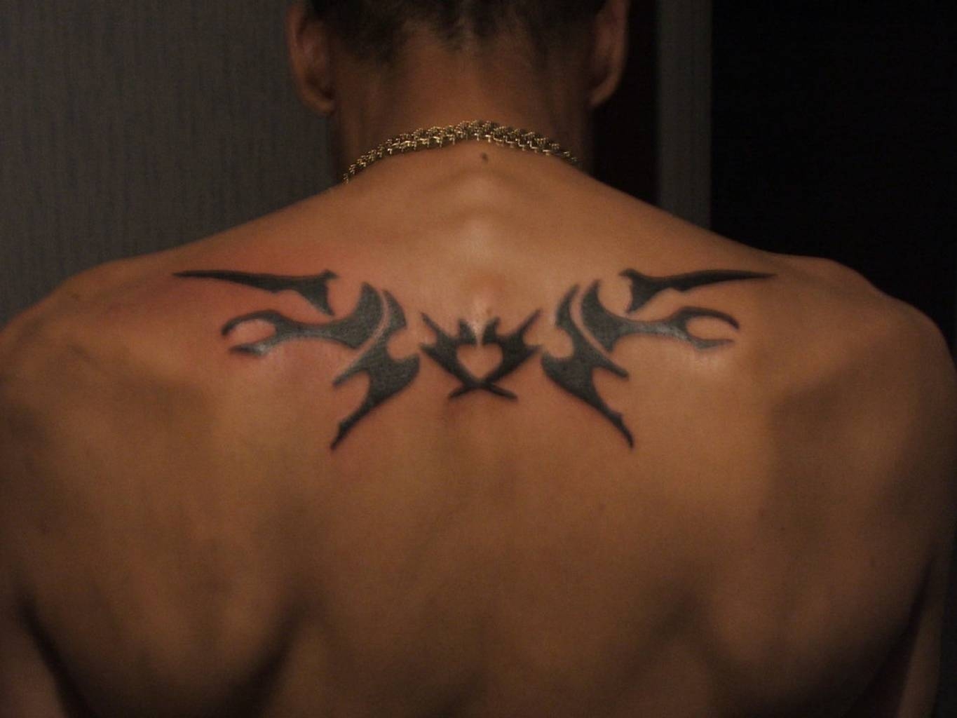 tribal men's back tattoo