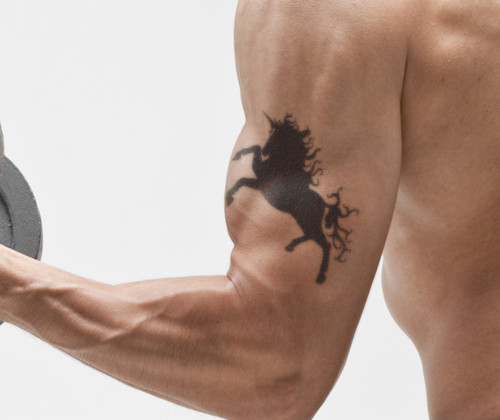 unicorn inner bicep tattoo for men