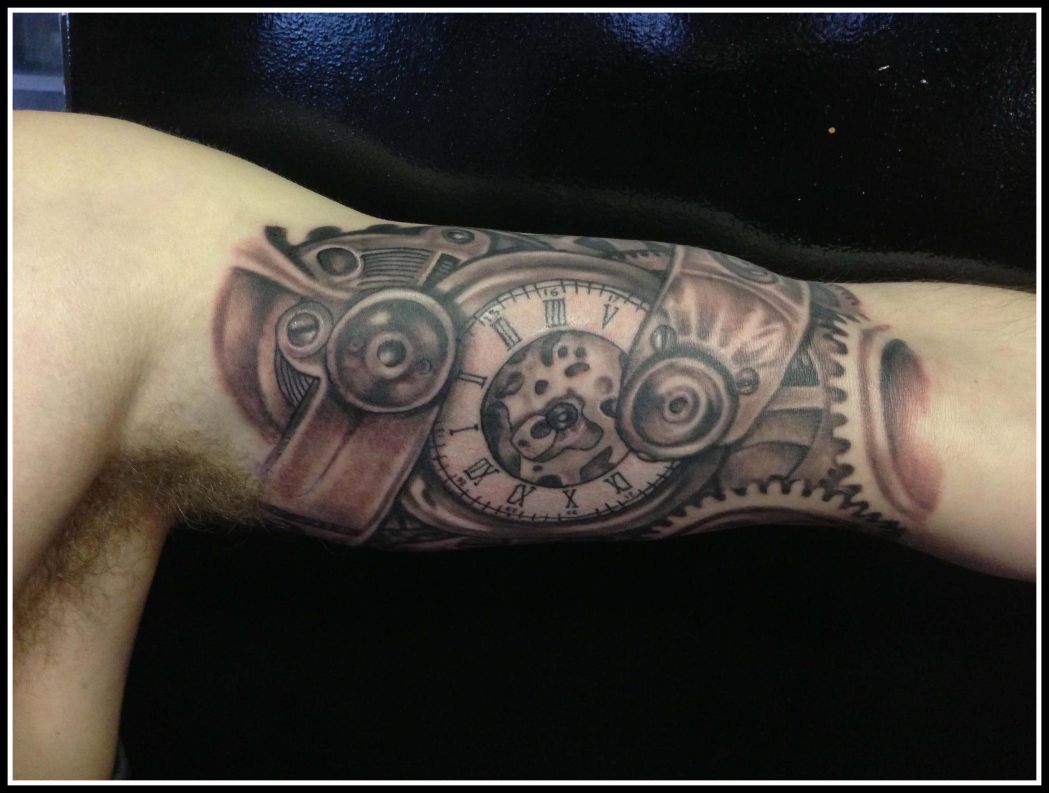 watch and gears inner bicep tattoo for men