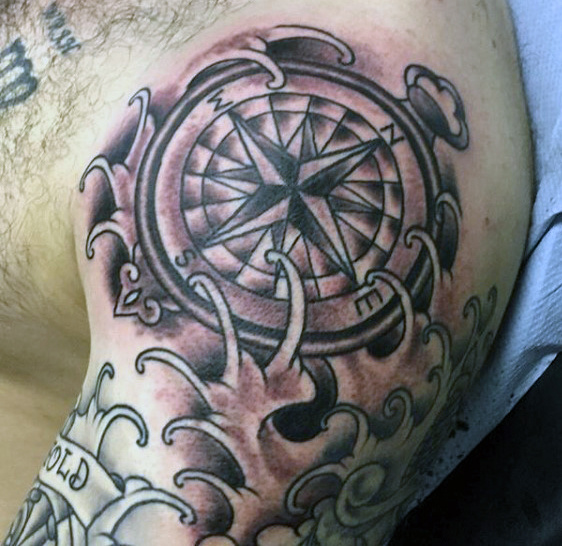 whisps and compass tattoo design for men