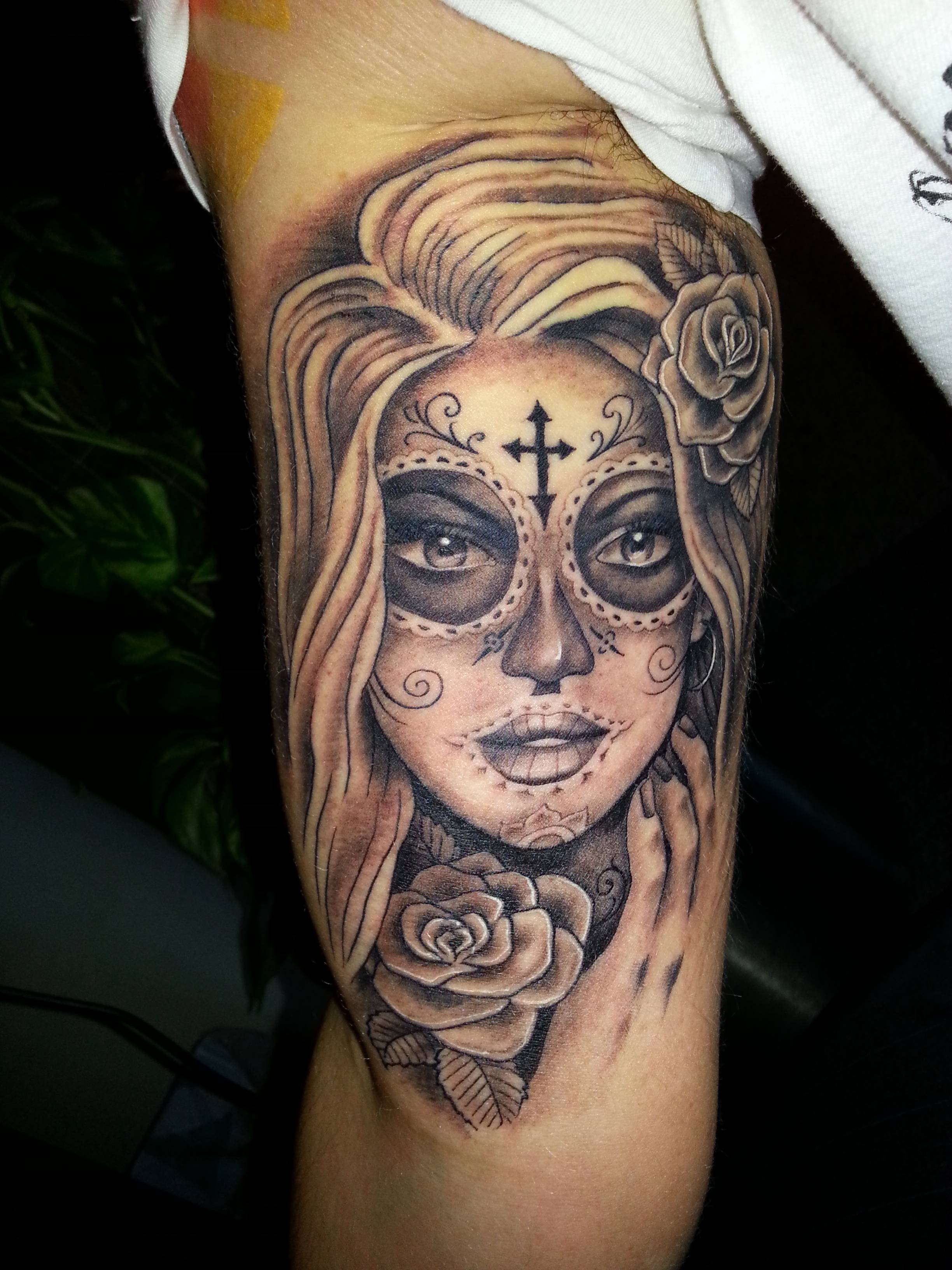 woman's death face inner bicep tattoo for men