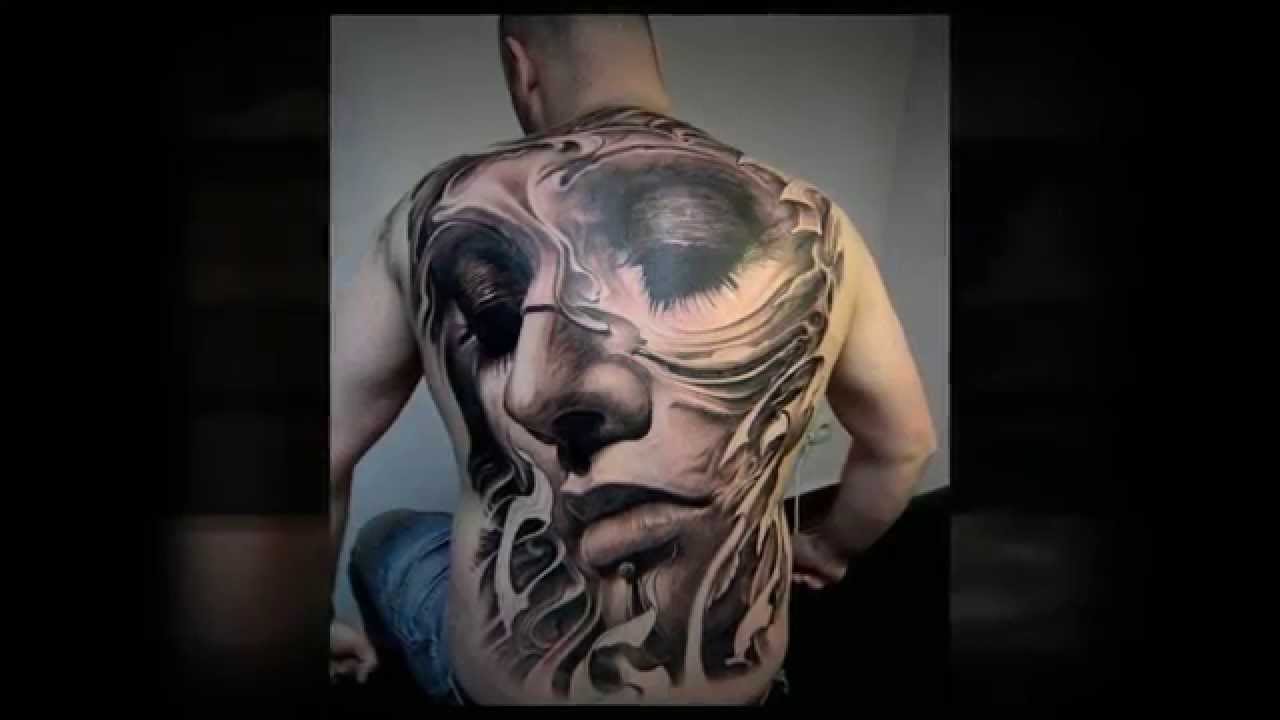 woman's face back tattoo for men
