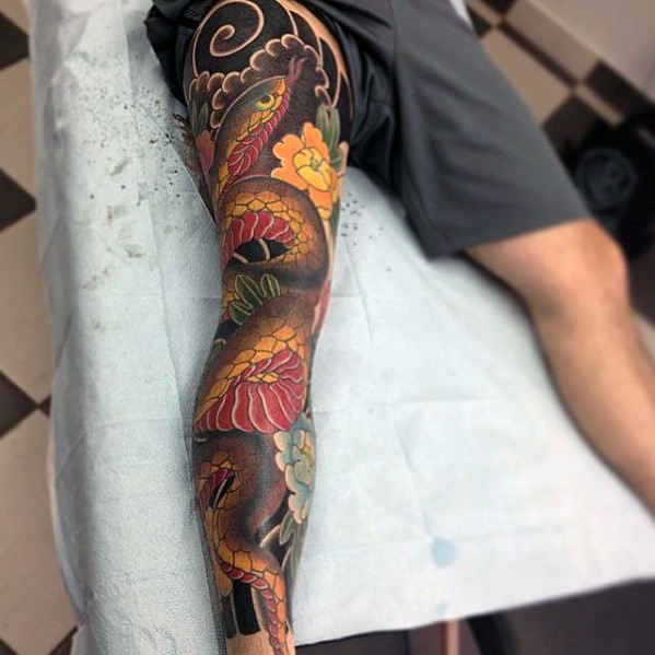 colored snake leg tattoo for men