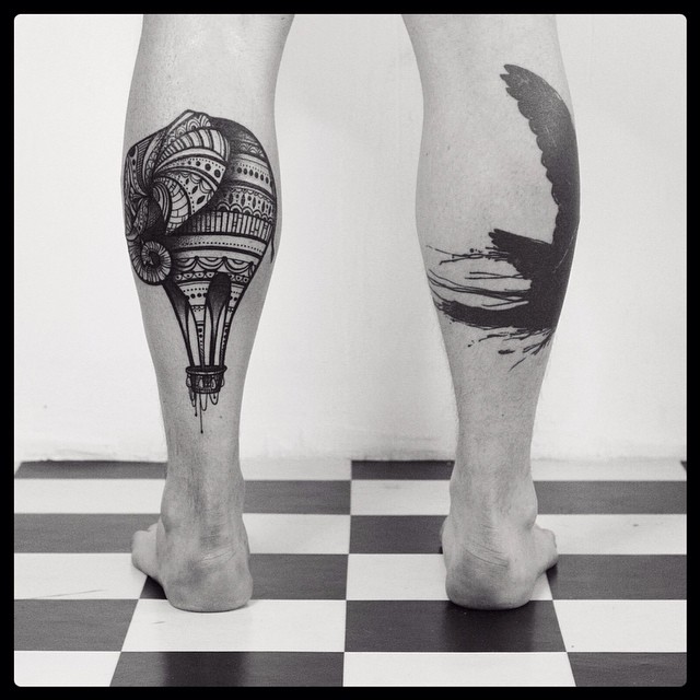 hot air balloon and bird leg tattoo for guys