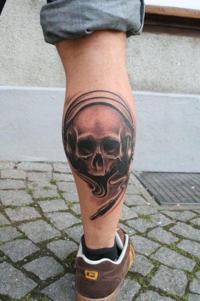 skull wearing headphones leg tattoo for men