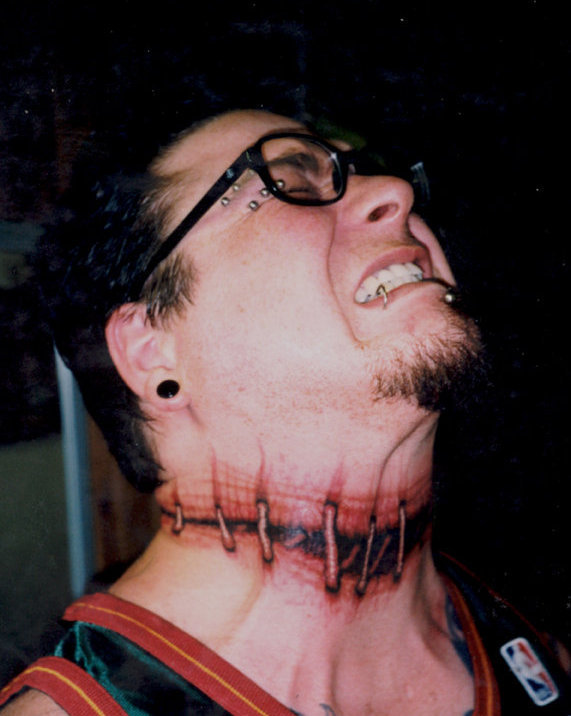 severed head neck tattoo for men