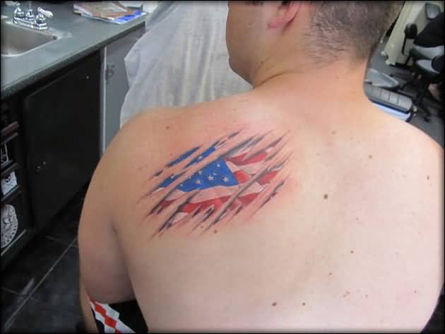 torn back american flag tattoo for men