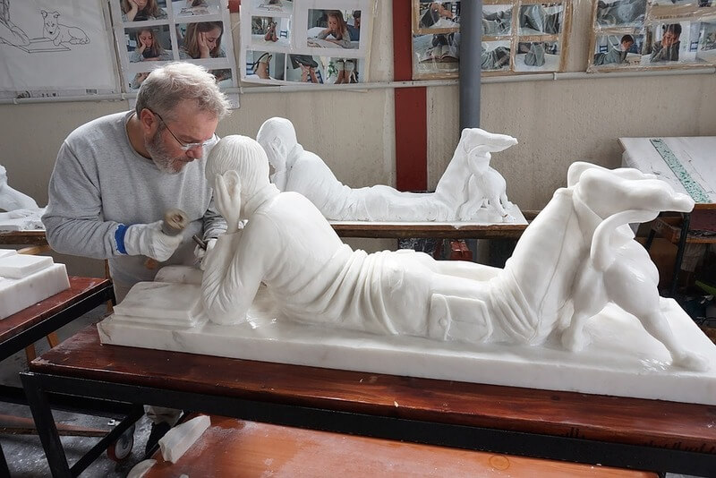 sculpting a white statue