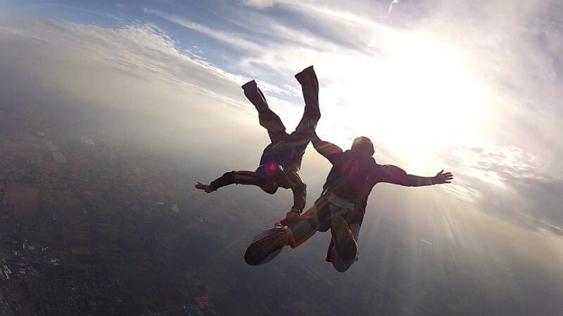 two skydivers in the sky