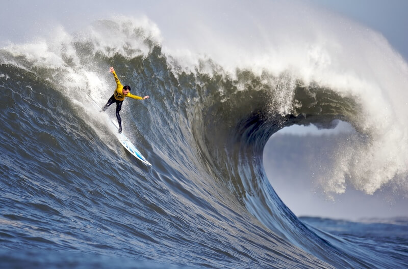 guy surfing a huge wave