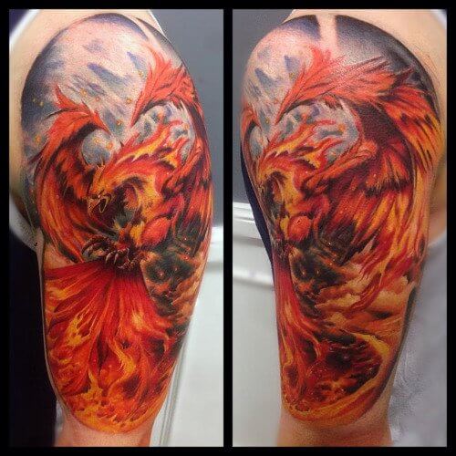 Classic-Flaming-Phoenix-Tattoo-On-Left-Upper-Arm-By-Mark-Stewart