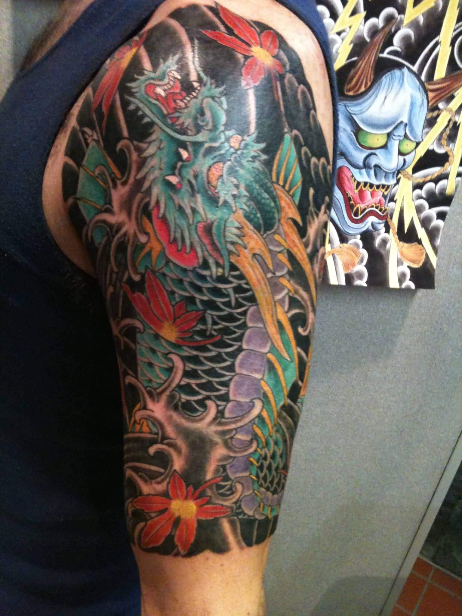 Colored-Japanese-Tattoo-On-Left-Half-Sleeve-by-Chris-Nunez