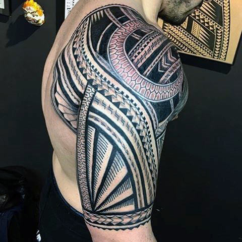 finely-detailed-male-tribal-shoulder-and-half-sleeve-tattoos