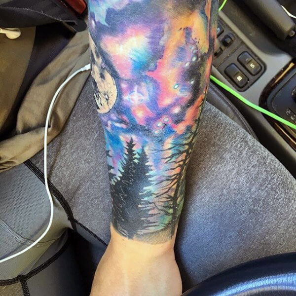 galaxy-watercolor-tattoo-for-men-on-forearm
