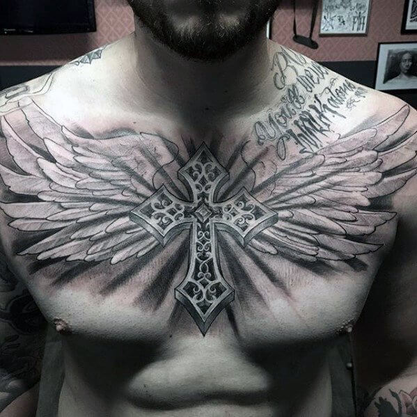 winged cross tattoo on chest