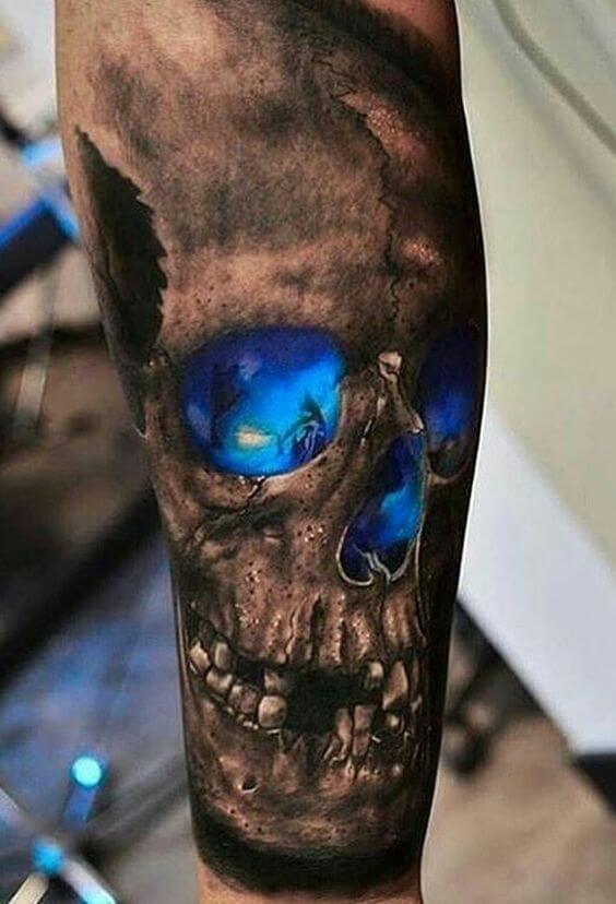 black-and-deep-blue-skull-tattoo-on-an-arm