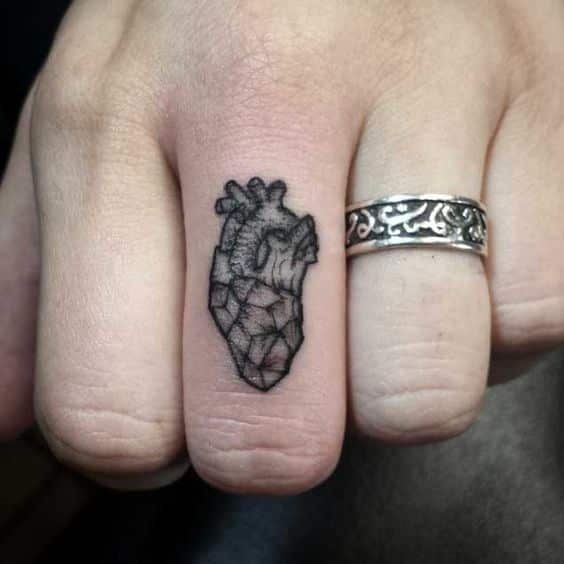 beating heart finger tattoo for men