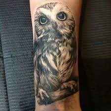 cute owl men's forearm tattoo