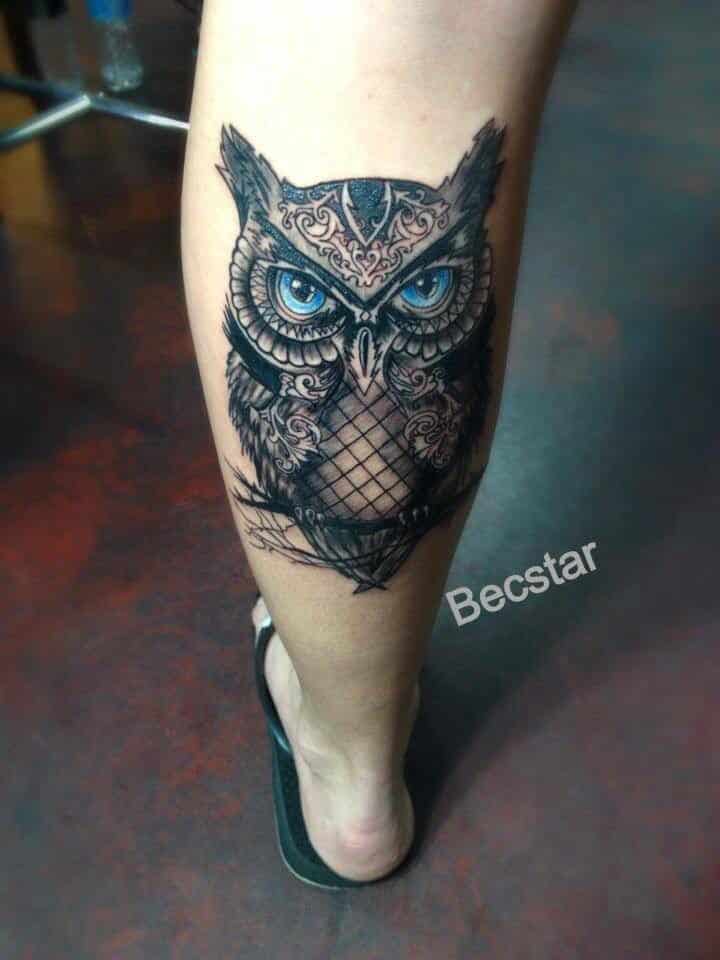 decorative owl design tattoo for men's legs