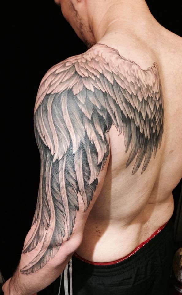 detailed back and arm wing tattoo for men
