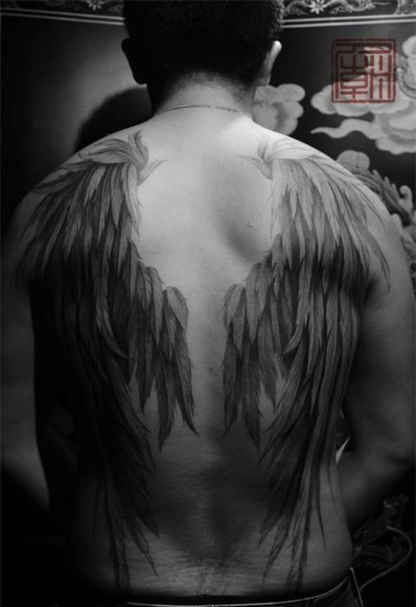 detailed wing tattoo for men's backs