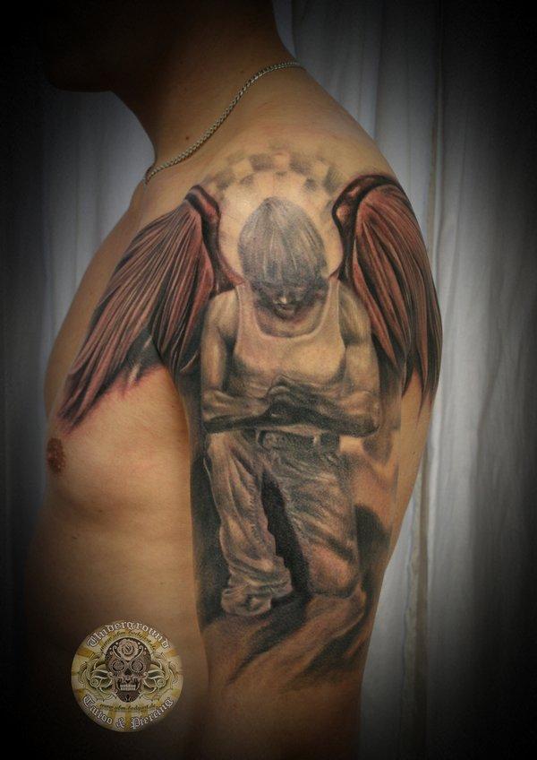 fallen angel with spread wings tattoo for men