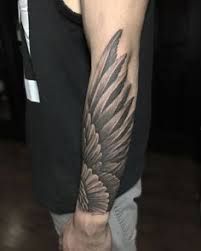 forearm wing tattoo for men