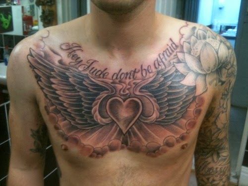 heart and wings chest tattoo for men