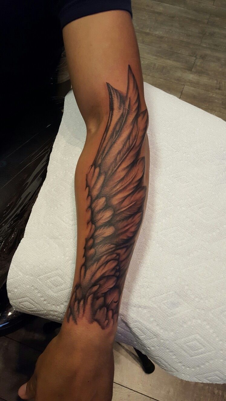 interesting wing tattoo for men's forearms