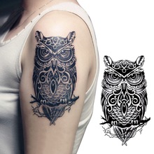 jeweled owl design men's arm tattoo