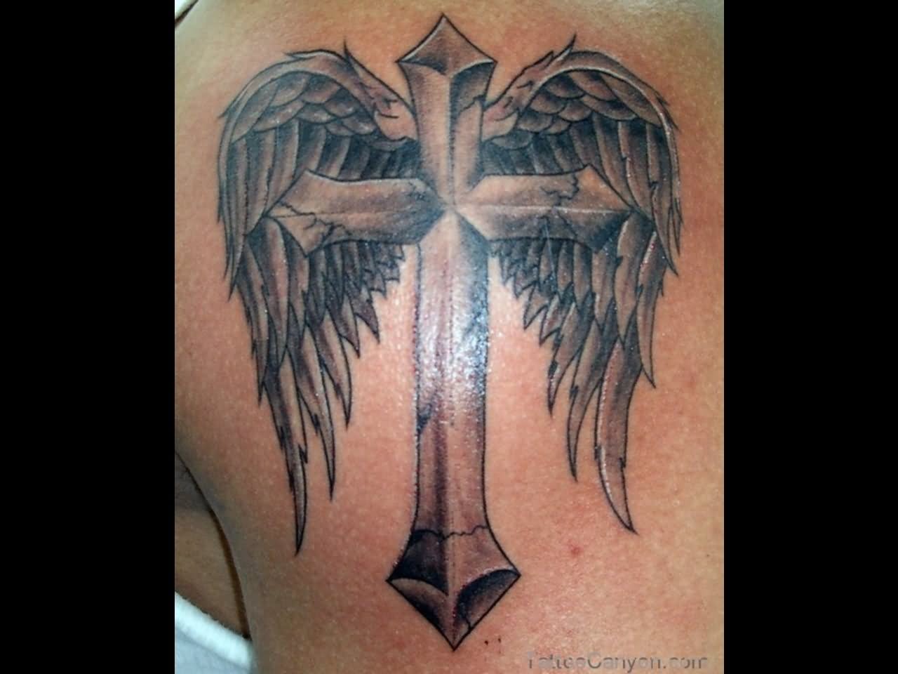 large cross with wings tattoo for men